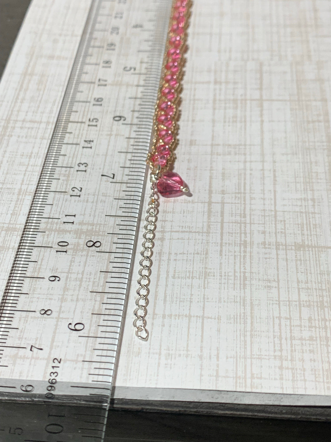 Pink rose gold tone beaded bracelet